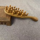 Wooden massage comb