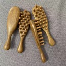 Wooden massage comb