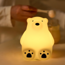 Little white bear pats the light