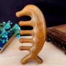 Wooden massage comb